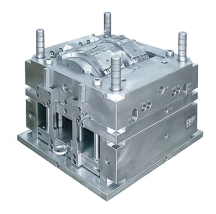CNC machine carving a high-precision steel mold for plastic injection.